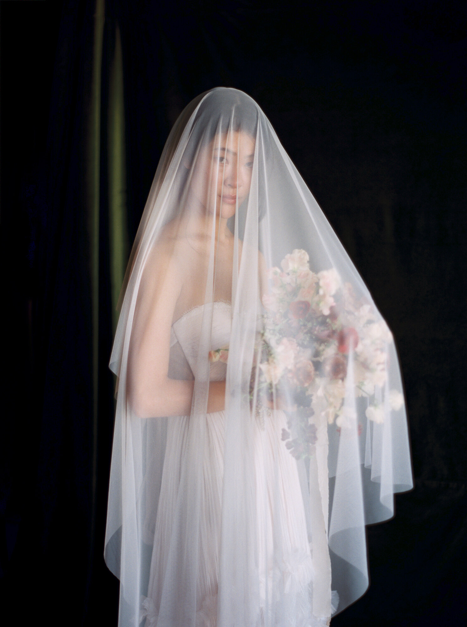 Bride covered in veil with florals in downtown Los Angeles, by JS Rhos