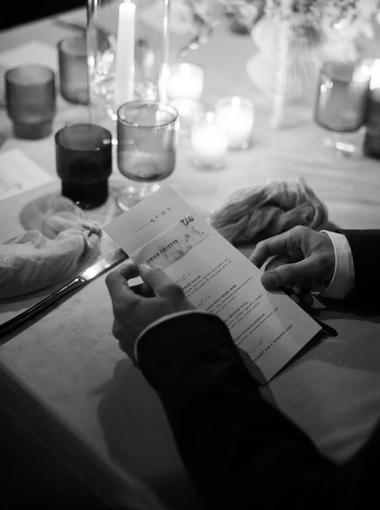 Wedding guest looking at menu in Los Angeles