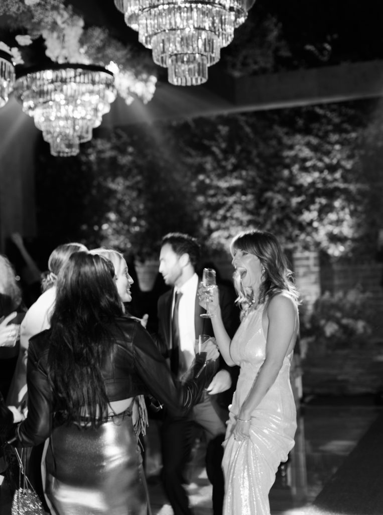 Bride dancing with friends at reception in Los Angeles by JS Rhos