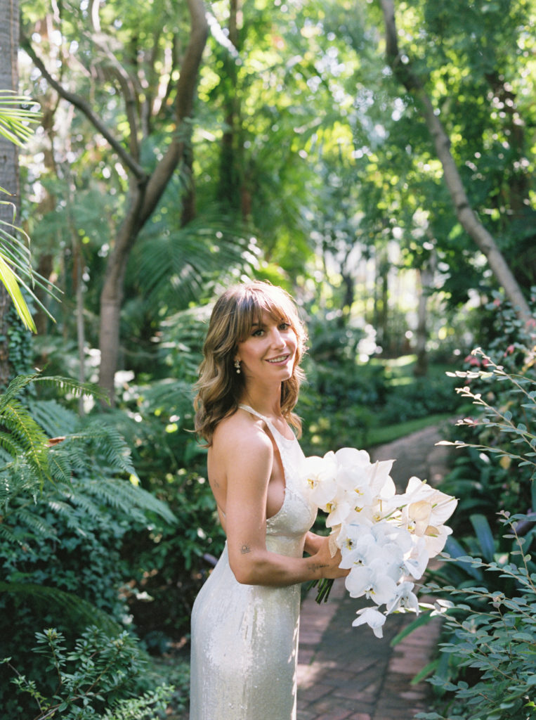 Bride smiling back into camera at Sunset Marquis
