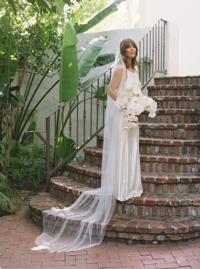 Classic hollywood bride on stairs in Sunset Marquis, Los Angeles by JS Rhos