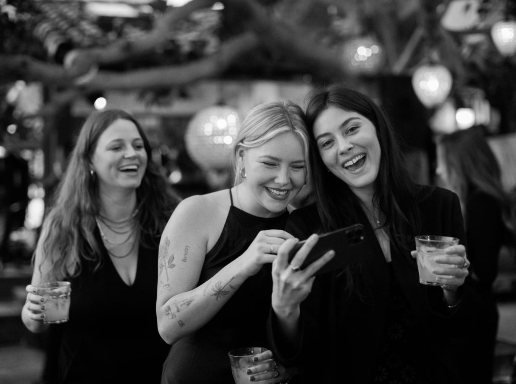 Wedding guests laughing at reception in Los Angeles